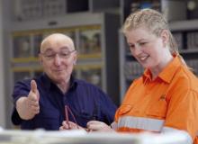 Jacinta Sapwell in high vis clothing with a teacher
