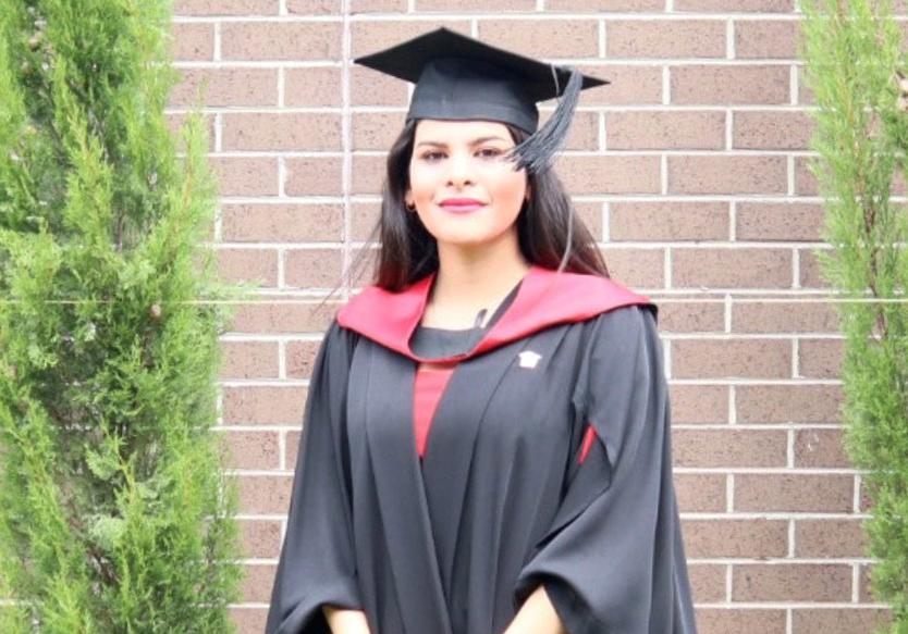 Sara Hamidavi in her graduation gown and cap, outside